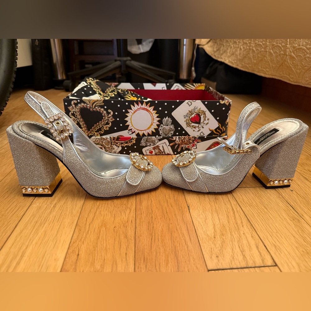 Dolce & Gabbana Elegant Silver Women's Heels with Gold Accents
Worn once